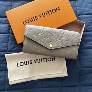 Louis Vuitton Gray Wallet with Monogram Embossing